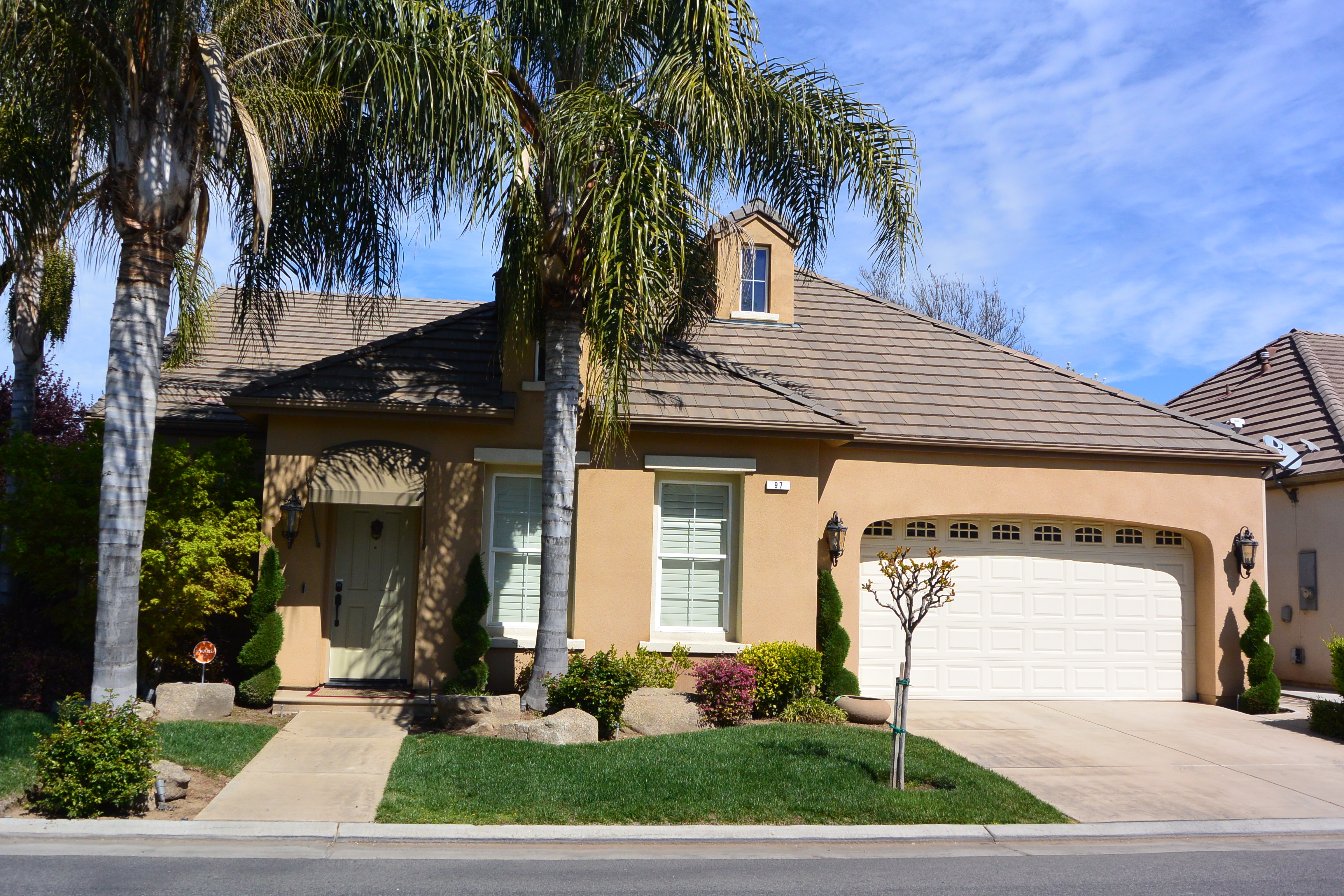 Gated Community Homes Leo Wilson's Kings Crossing Clovis Ca. 93619  If you are searching for a gated community in Clovis CA. 93619 then you probably have stumbled upon the Leo Wilson Kings Crossing homes.  Other than Monte Verdi Estates and Quail Lakes, this may be the nicest gated community in all of Clovis.  The HOA fee is reasonable as it only covers the security gates and some green belts/landscaping in the common areas.  There are two separate Kings Crossing communities.  One of them is on the west side of Minnewawa and the other is on the east side of Clovis.  Both are between Teague and Sheperd Ave from the north and south.   In the past six months there have been seven sales in these two neighborhoods.  Those sales have ranged from $337,000-$410,000.  These sales ranged from 2,031 - 2,721 sq. ft.  On average these sales went for nearly $162 per sq. ft.  Two homes are currently pending in escrow and there are four homes listed as active sales.  Interestingly enough these four homes that are actively for sale are all the 2,721 sq. ft. floor plan.  These homes are listed between $395,000 - $449,500.   The locations of these communities are ideally situated near Woods Elementary and the Buchanan Educational Complex.  The community along Clovis Ave. is bordered by a Dry Creek and the Dry Creek running walking path.  This path starts at Sunnyside and Shepherd Avenues and continues for 2.5 miles until it reaches the Clovis Old Town Trail which goes another 5.8 miles.  As a result, this community is ideally located for those who like to stay active and be outdoors in this warmer central valley climate.  If there is one negative aspect about the community it is that the front yards are very small.  The homes almost sit on the curbs.  As you drive through the streets you may get a claustrophobic feeling.  The lot sizes average about 7,000 sq. ft. with many in the 6,000 range but others from 10,000-12,000.  To see what is available in and around these communities in active time you may click here.    Gated Community Homes Leo Wilson's Kings Crossing Clovis Ca. 93619